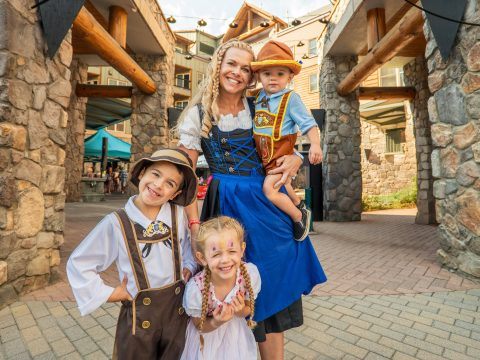 Festival-goers celebrating at Keystone Oktoberfest